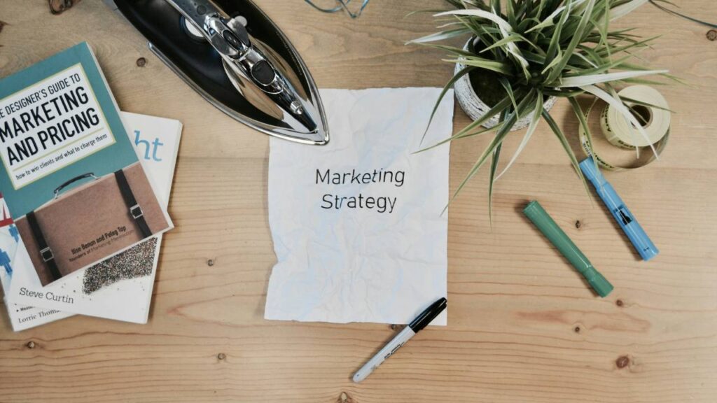 A paper with "marketing strategy" written on it