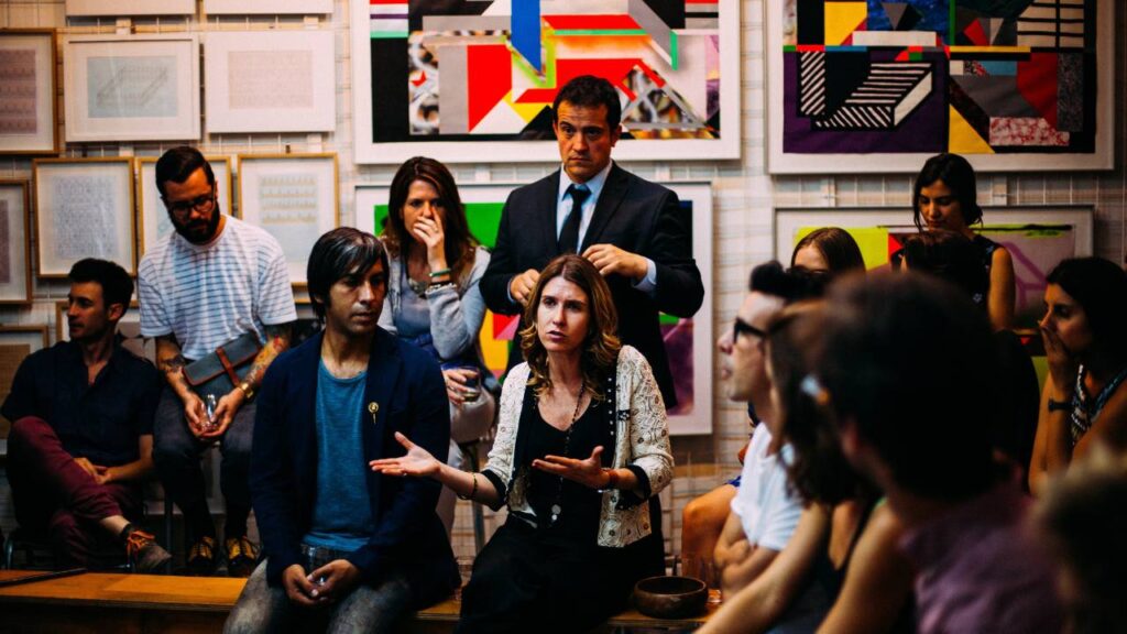 A dozen people attending a business meeting