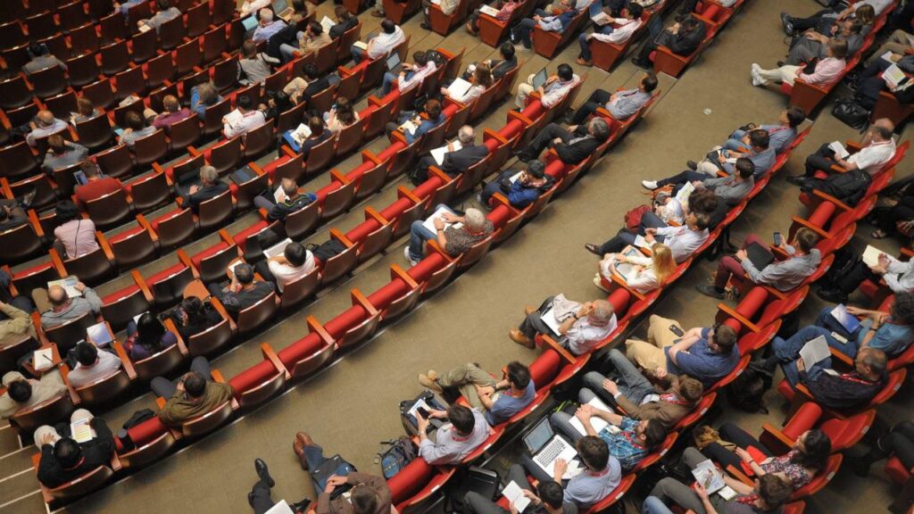 Lots of people attending a business conference