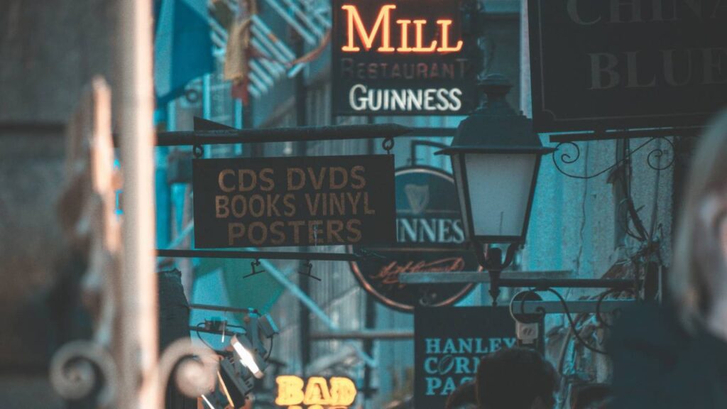 Various neon and physical signs in an old street 